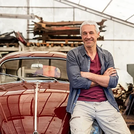 Man sitting on car