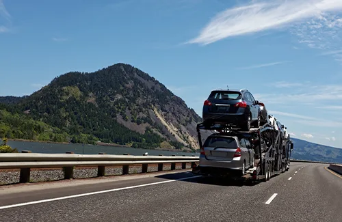 Vehicle being transported over a bridge